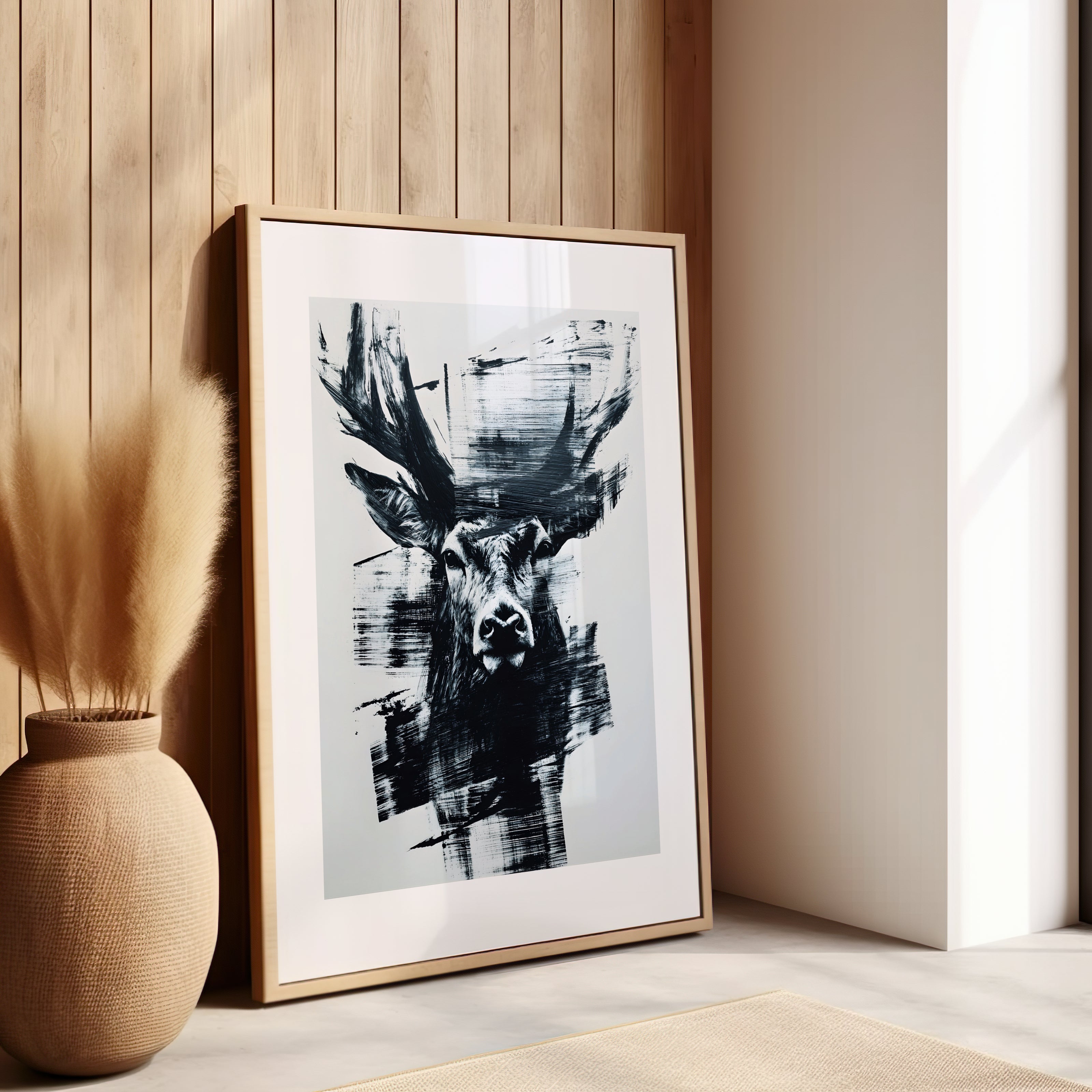Tableau d'un cerf noir et blanc dans un salon